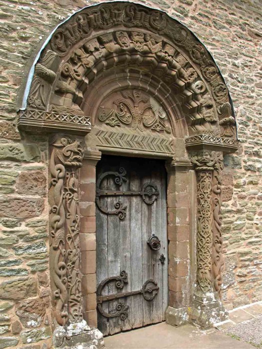 Arched church door with carvings