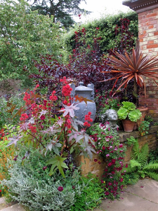 Pots, urns, flowers and a sculpted head