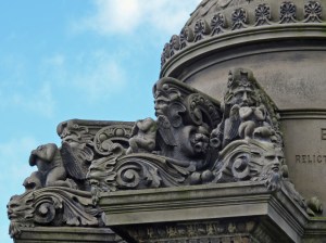 Three headless cherubs