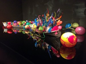Chihuly art glass boats on a mirror