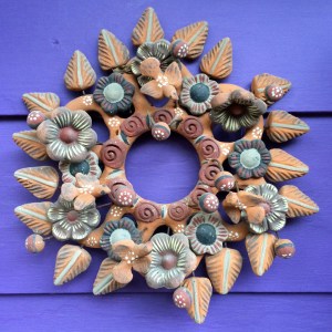 Pottery wall decoration with birds, leaves and flowers