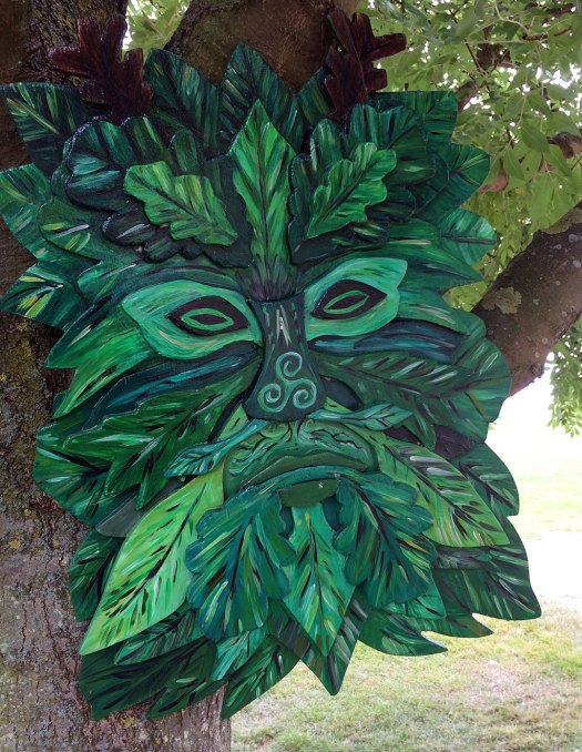 Wooden green man face in a tree