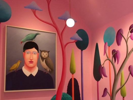 A painting of an androgynous figure with birds