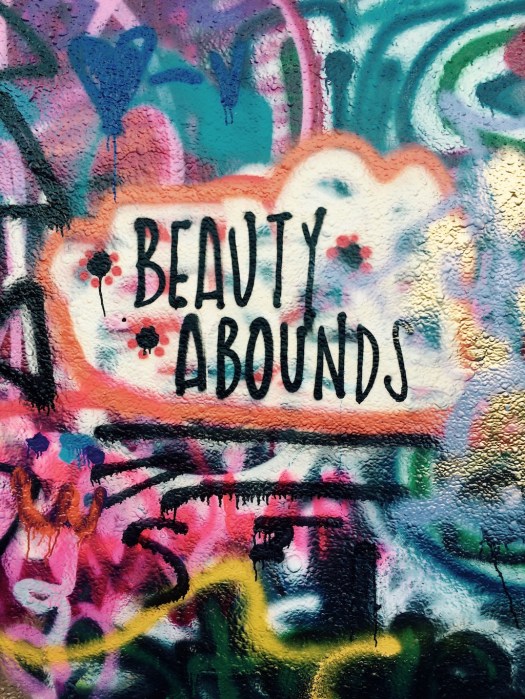 Graffiti around the words: Beauty Abounds