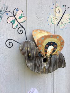 A small birdhouse shaped like a bee