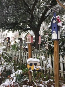 Various birdhouses including one like a caravan