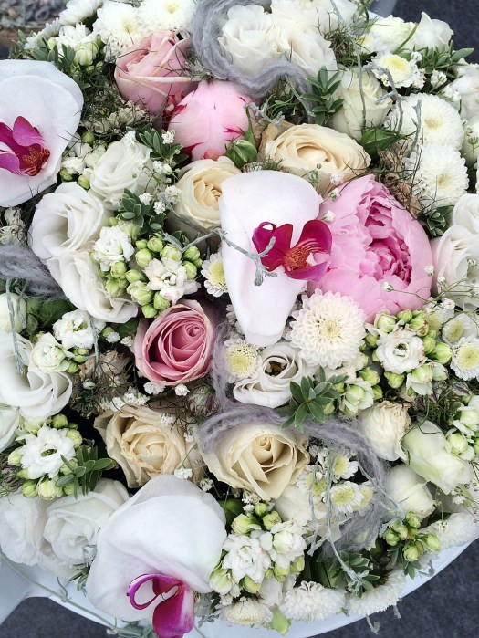 Dish of flower buds and orchids for a wedding