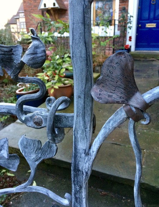 Detail of gate showing latch and maker's tag