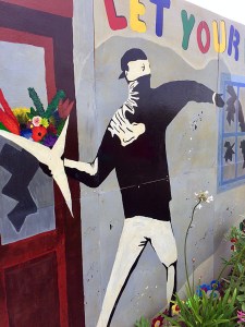 Masked figure with a flower bouquet