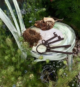 Chair with wire flowers, bird nest and large ring of keys