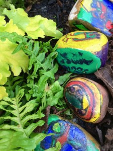 Hand painted stones line a path