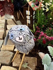 Toy with heart shaped nose made out of a ball of wool