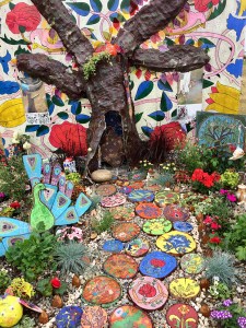 Colourful children's garden with tree trunk path