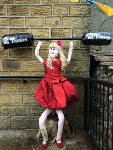 Woman in red party dress lifting weights
