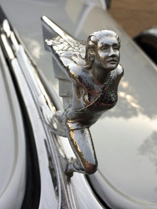 Female hood ornament with graceful posture