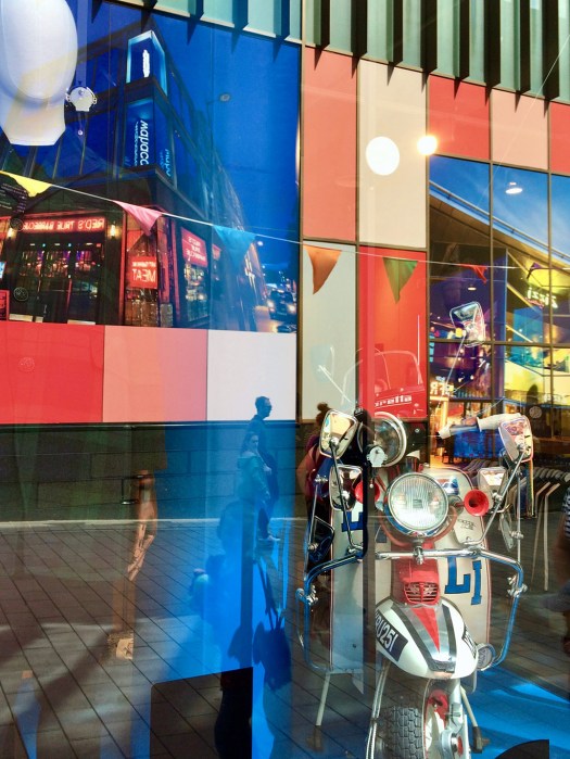 Colourful reflections and patterns in a shop window