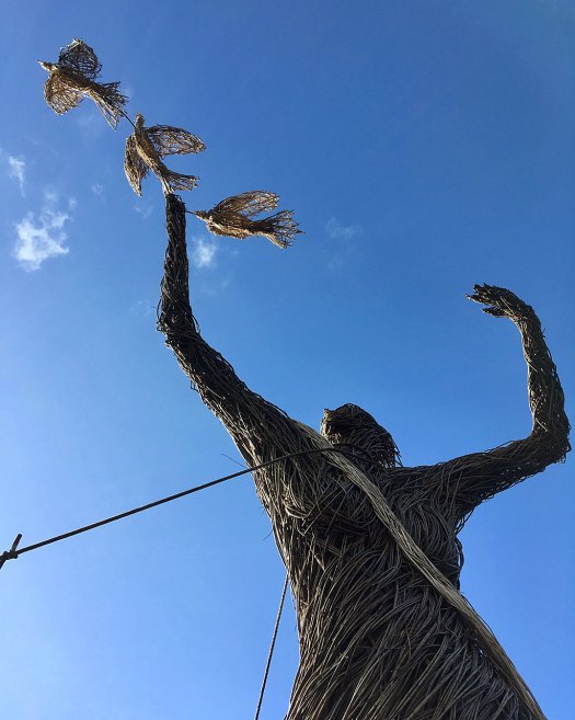 18ft tall willow woman holding three doves