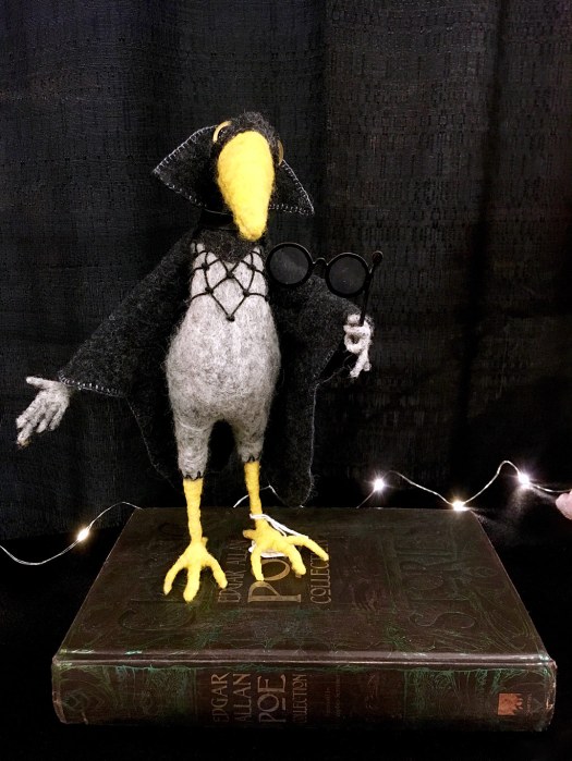 Felt crow in a black cape
