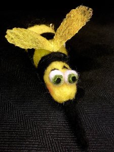 Yellow and black insect with a long sting