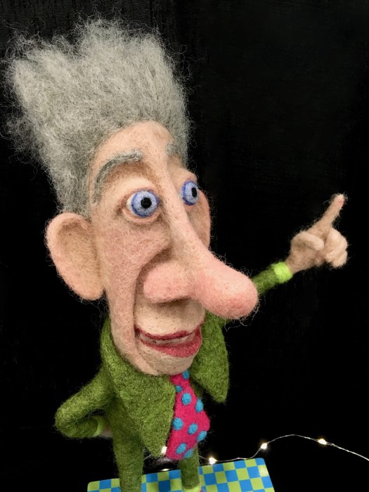 Pointing man with grey hair and large nose