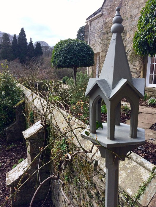 Grey painted bird feeder