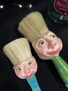 Paint brushes with smiling faces