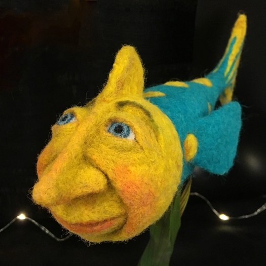 Felt art fish with human face