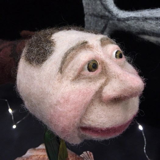 Felt fish with a monk's face