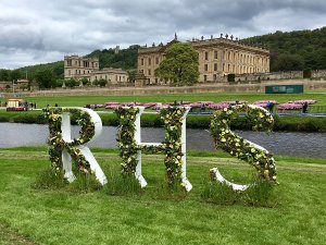 RHS floral logo with Chatsworth House in the background