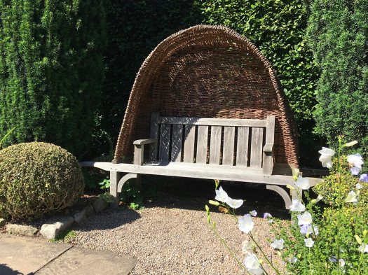 Beautiful wooden bench with wicker canopy