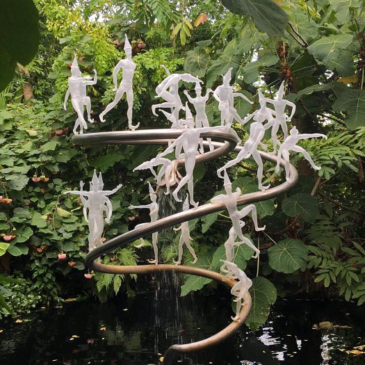 Glass clowns in different postures by Fräbel