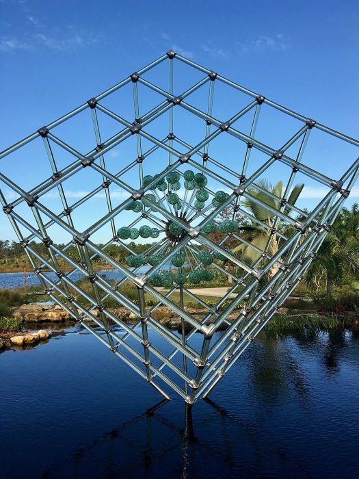 Large cube with imploding glass spheres by Hans Godo Fräbel