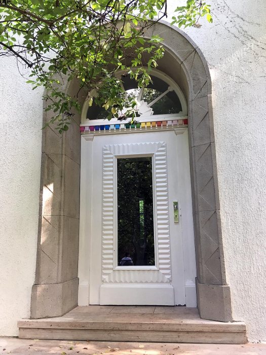 White door with arc window and colour chip border