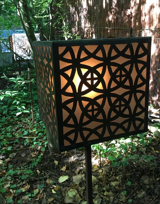 The vortex garden's lamps carry geometric patterns