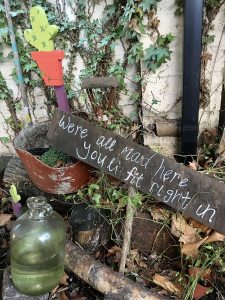 Sign: We're all mad here - you'll fit right in