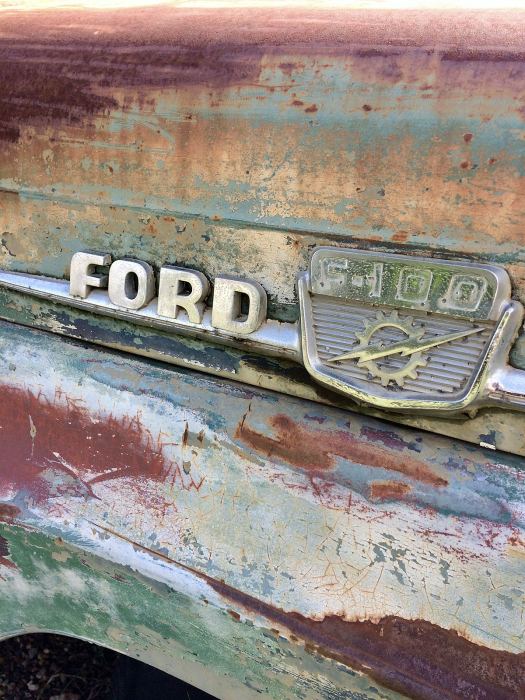 Ford logo on a rusty car
