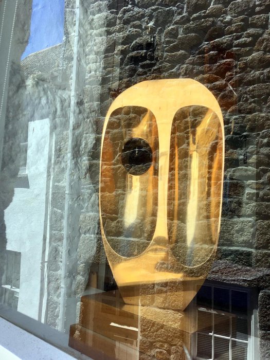 Vertical Form (St Ives), a bronze sculpture, with reflections