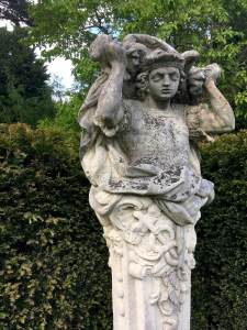 Statue of a figure with cape