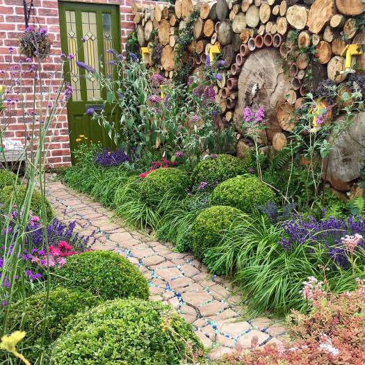 Insect hotel wall made from trunks and tubes