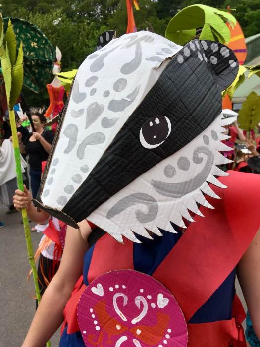 Street parade performer in a handmade badger mask