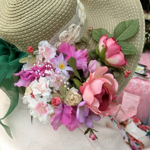 Tea hat with artificial flowers and bow