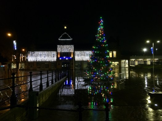 Darwen market with Christmas tree after rain
