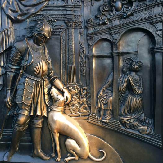 Dog on a panel rubbed gold by tourists, Charles Bridge