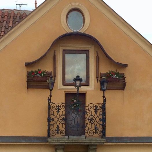 Tiny balcony on the end of a house in Prague