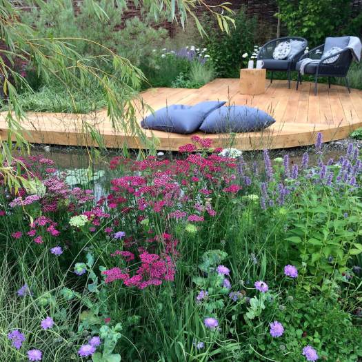 Raised by Rivers garden with flowerbeds and oak decking
