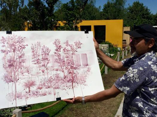 Artist with a painting of the Santa Rita garden at Hampton Court