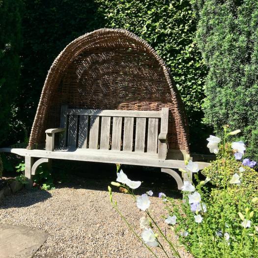 Wood and wicker Arts and Crafts style bench