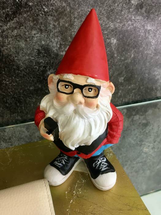 Gnome wearing glasses and Converse shoes