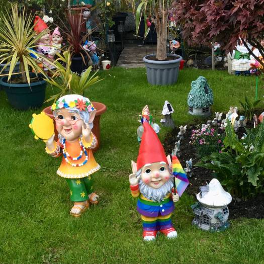 Lawn ornaments - gnomes, tambourine player and mushrooms