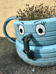 Tire planter with painted face